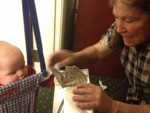 Grandma Jan opening her grandmother's brag book